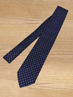 Cravate bleu marine à motifs géométriques pois bleus