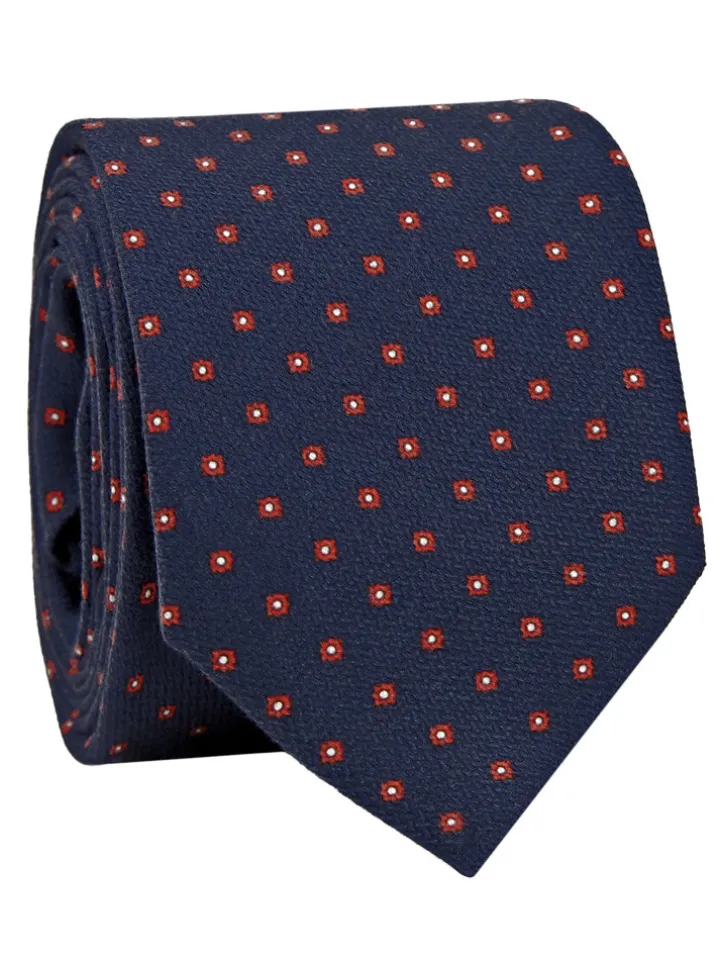 Cravate bleu marine à motifs rouges et blancs